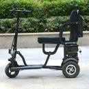 Left Side View Of The MotoTec Folding Mobility Electric Trike 48v 700w Dual Motor Lithium Shown In An Outdoor Setting
