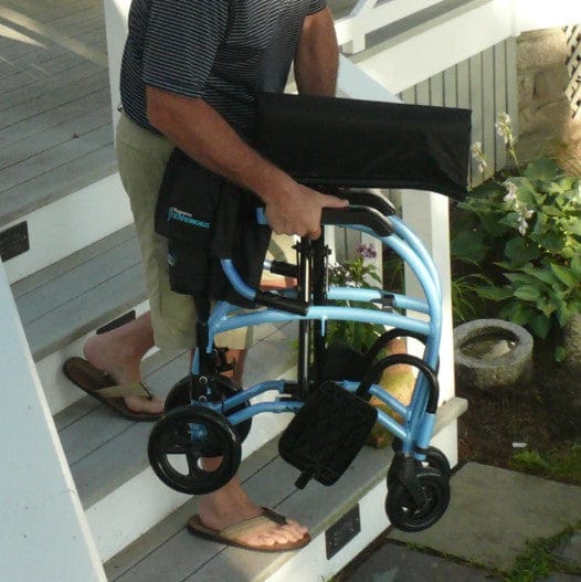 Man Carrying The Strongback Excursion 8 Lightweight Transport Chair In The Folded Position Highlighting Its Lightweight Frame