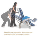 Side View Of The Med Mizer FlexTilt Comfort Chair Shown With A Caregiver Operating The Unlimited Positioning Capabilities Of The Chair